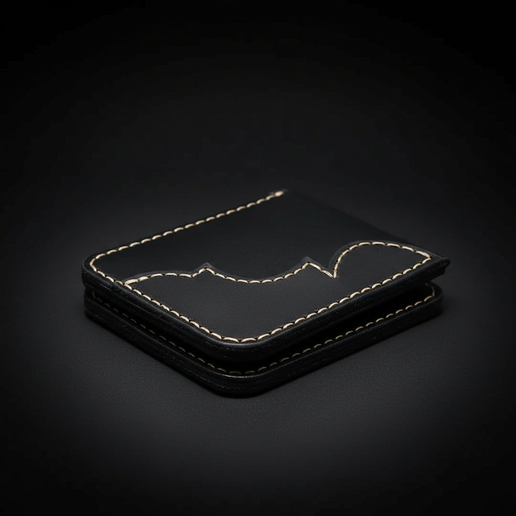 Handmade tan leather bifold wallet with stitched edges on black background, premium minimalist men’s wallet by Hadi Craft USA