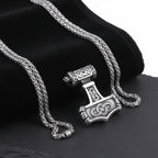 Thor Mjolnir Viking necklace gift box showcasing a detailed silver hammer pendant on a braided chain.