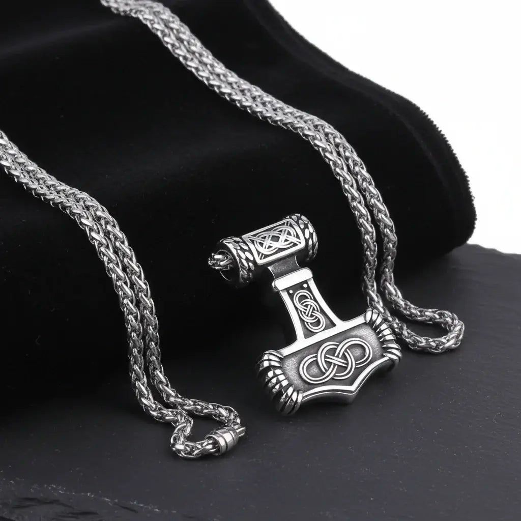 Thor Mjolnir Viking necklace gift box showcasing a detailed silver hammer pendant on a braided chain.