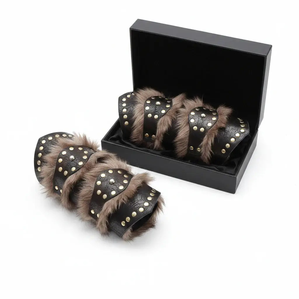 Viking leather bracers for cosplay with faux fur in a box, perfect for Medieval Warrior arm armor at LARP, Renaissance Fair, and Halloween.