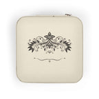 Compact pink jewelry travel organizer with elegant floral design on top, ideal for storing rings and earrings.