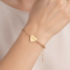 Alt Tag: Engraved paperclip heart bracelet – Engraved Heart Charm Chain in gold on wrist, personalized heart charm, Hadi Craft USA bracelet, engraved jewelry