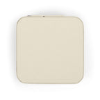 Compact pink jewelry travel organizer for storing rings, earrings, and necklaces in a stylish travel-friendly design.