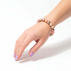 Repair My Heart - The Peruvian Pink Opal Bracelet on wrist, handmade beaded bracelet by Hadi Craft USA, pink opal jewelry