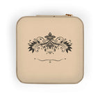 Compact pink jewelry travel organizer with an elegant floral design, perfect for storing jewelry on the go.