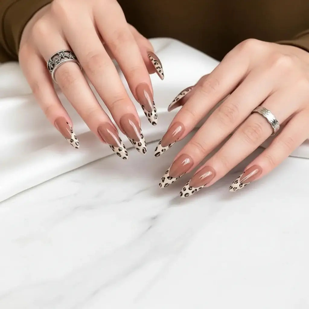 Alt Tag: Leopard Print French Almond Press-On Nails with Bow & Pearl by Hadi Craft USA, long nude leopard tips, fashion manicure, handmade press-on