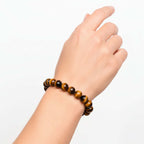 Alt Tag: Built to Win – 7A Grade Tiger’s Eye Bracelet by Hadi Craft USA on wrist, handmade beaded bracelet, tiger’s eye jewelry