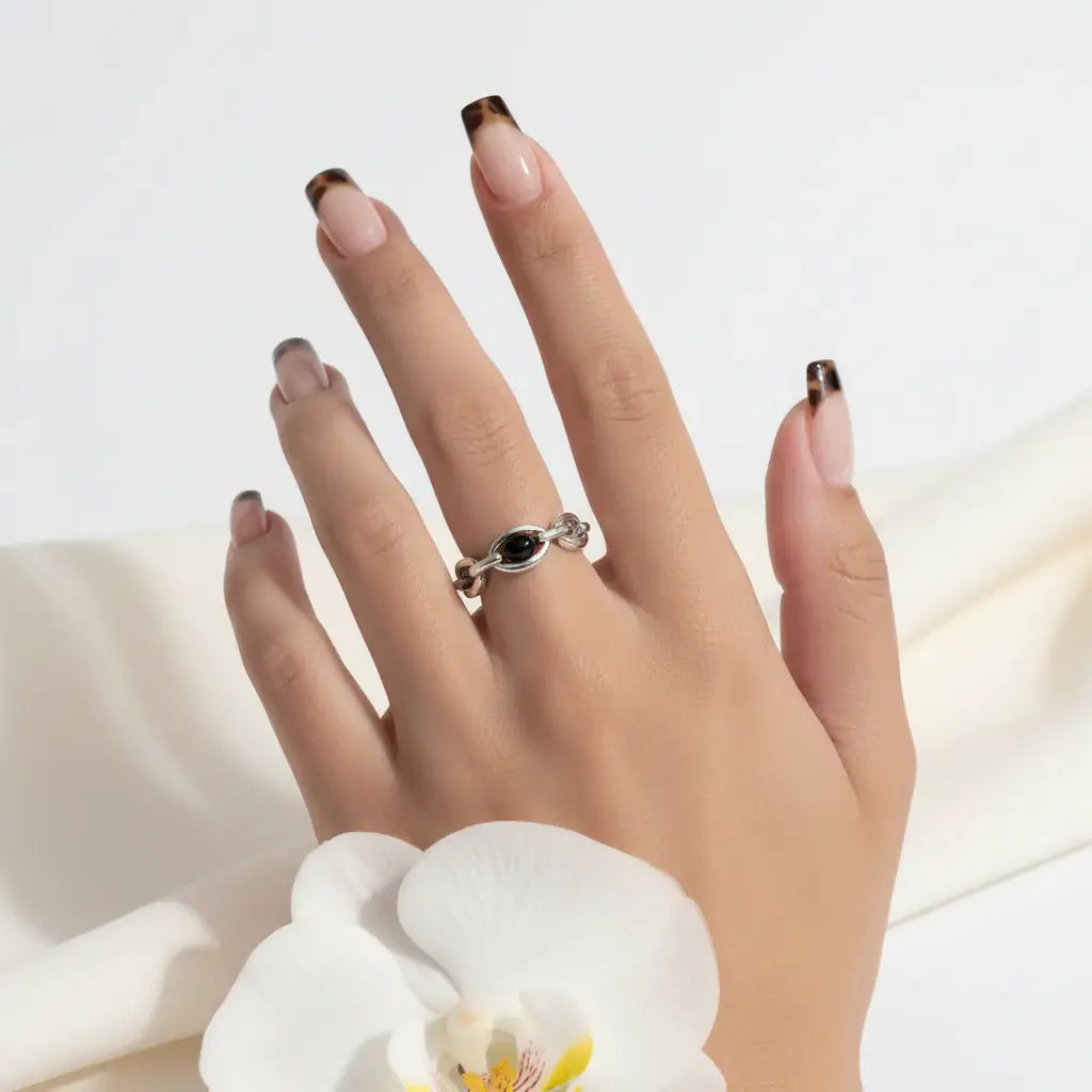 Alt Tag: Hadi Craft USA Leopard Print French Almond Press-On Nails with Bow & Pearl on hand, fashion earrings, handmade metal wall sign style